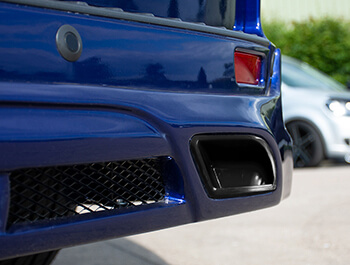 Black Exhaust Covers For Rear Valance - Ford Custom 2012>